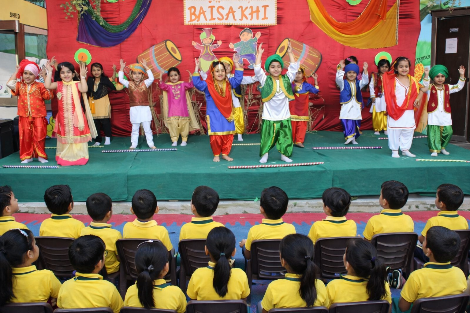 Aerial view of the Sanskar The Smart School campus and school buses
